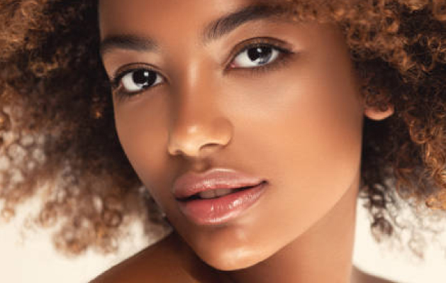 Interior of Columbus med spa featuring modern reception, skincare retail shelves, and private treatment rooms in a luxury setting.